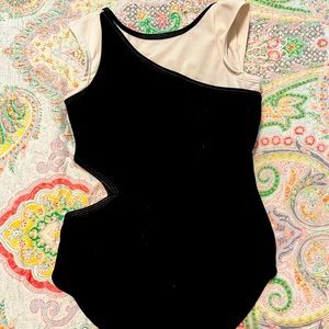 Oh La La black and white leotard, cut out on right side, child large